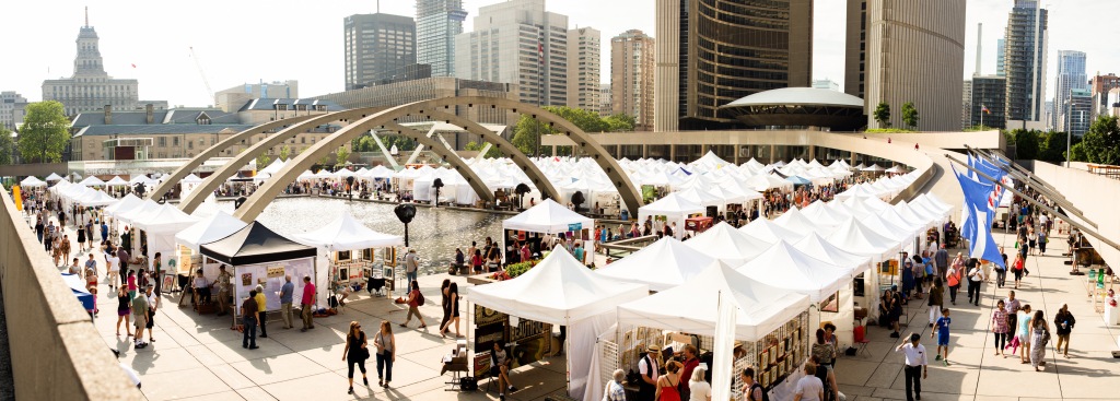 Sea of white tents at Toronto Outdoor Art Fair at Nathan Phillips Square, looking towards city hall